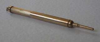 A gilt metal propelling pencil