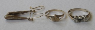 A gold ring mount - stones missing, a gold heart shaped signet ring and a pair of gilt earrings