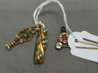 A gold bar brooch set turquoise and 1 other set a green stone and 3 stick pins