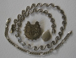 A silver horse shoe brooch marked Good Luck, a silver locket, a flat link silver bracelet and a silver necklace