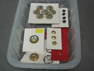 A collection of various enamelled buttons