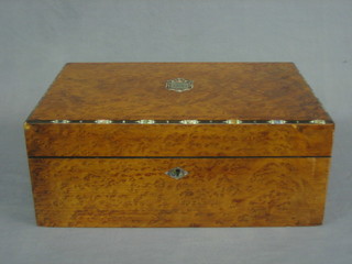 A figured walnut writing slope with hinged lid, crossbanded with mother of pearl 16"