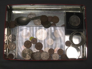 A silver  napkin ring, 1 other napkin ring and a small collection of coins