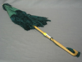 An Edwardian green silk parasol