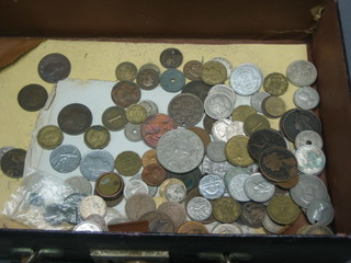 A small collection of various coins in a leather case