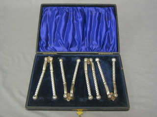 4 pairs of silver plated nut crackers, cased