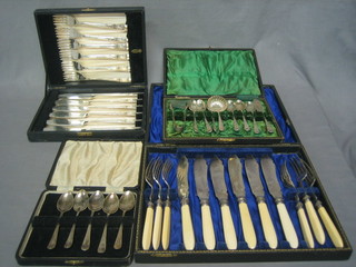 2 sets of 6 silver plated fish knives and forks, 6 silver plated teaspoons, a butter knife, sifter spoon, pair of sugar tongs and 5 coffee spoons, all cased