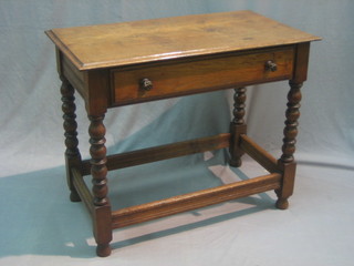 An 18th Century style carved oak side table fitted a drawer and raised on turned supports with box framed stretcher 34"