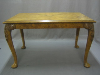 A Queen Anne style rectangular walnut coffee table, raised on cabriole supports 30"