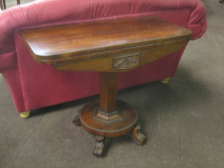 A Victorian rosewood D shaped card table, raised on a chamfered column with triform base and scroll feet 36"