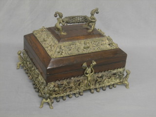 An Eastern rosewood sarcophagus shaped trinket box with hinged lid and heavy gilt metal mounts throughout 13"