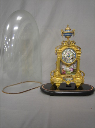 A 19th Century French 8 day striking mantel clock contained in a gilt metal and porcelain case, surmounted by an urn, complete with dome