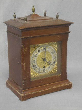 A striking bracket clock with gilt dial and silvered chapter ring, contained in a mahogany finished case
