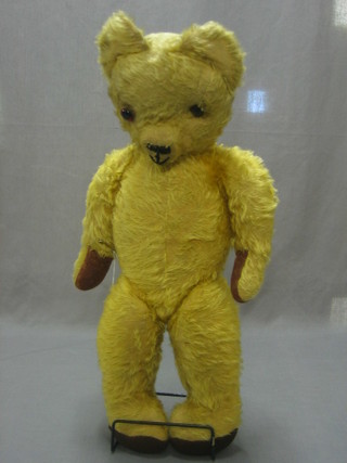A yellow teddy bear with articulated limbs 24"