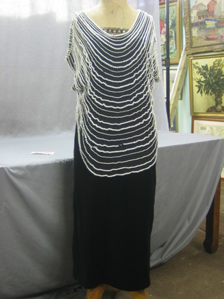 A lady's Sybil Zelker black velvet evening dress and a Frank Usher size 12 top decorated pearls