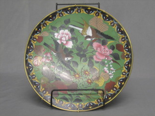 A green ground cloisonnÃ© charger decorated birds amidst branches 12"