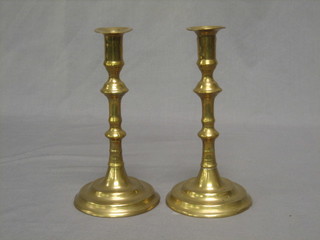A pair of circular 18th/19th Century brass candlesticks 8"