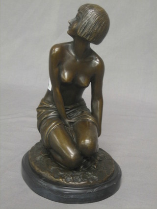 A reproduction Art Deco bronze figure of a seated naked lady 10"