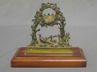 A 19th Century brass watch stand, the base decorated a walking pheasant 9"