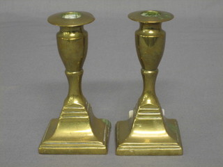 A pair of square brass stub shaped candlesticks 5"