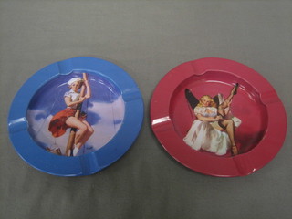 A pair of 1950's pressed metal ashtrays decorated saucy scenes, 5"