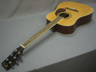 An acoustic guitar, the head marked Martin & Co, contained in a carrying case