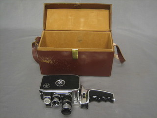 A Bolex 8mm cine camera with telephoto lens, contained in a leather case