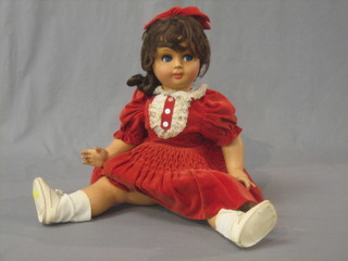 A plastic doll, the back marked Athena 60 Damina 26" long 
