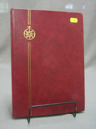 A red stock book of stamps containing GB mint and used stamps