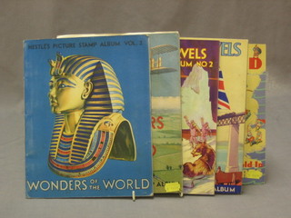 2 Nestle's Wonders of the World picture card albums, a Moore British Marbles album, a Cadbury's British Marbles album and 1 other This England 