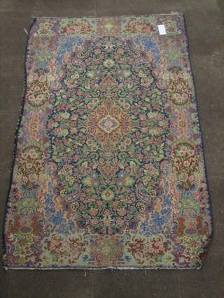 A fine quality blue ground Persian rug with central floral medallion 80" x 50"