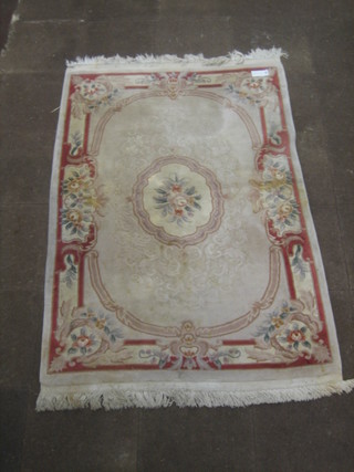 A peach ground floral patterned Chinese rug 78" x 55"