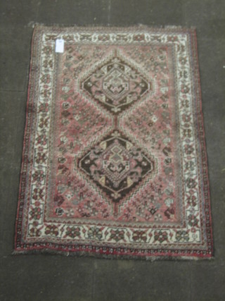 A contemporary faded pink ground Eastern rug 60" x 42"