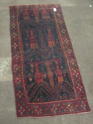 A modern Persian dark ground carpet with all over geometric design 110" x 49"