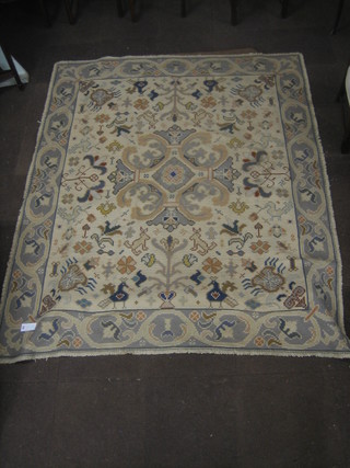 An Eastern white ground woven rug decorated animals 103" x 84"