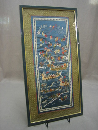 An Oriental blue ground embroidered panel decorated dragon racing scenes 25" x 12"