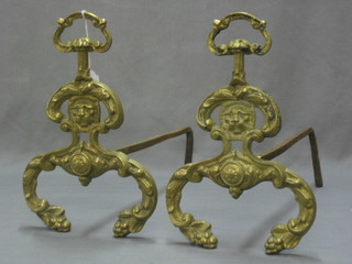 A pair of French 18th/19th Century brass  and iron fire dogs