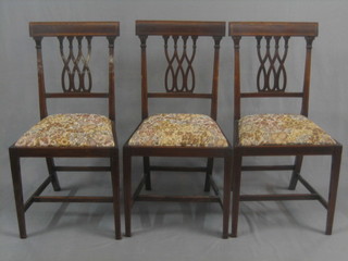 A set of 3 19th Century inlaid mahogany bar back dining chairs with tracery work back and upholstered seats, raised on square tapering supports