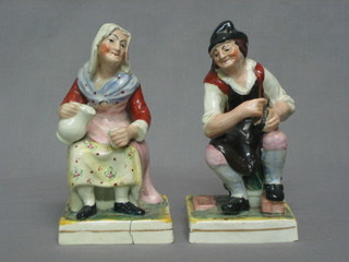 A pair of Staffordshire figures of seated lady and gentleman, on square bases 6" (1 f and r)