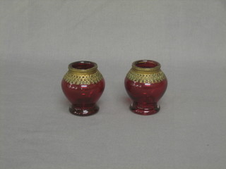 A pair of Continental red glass globular shaped vases with gilt metal mounts 2"