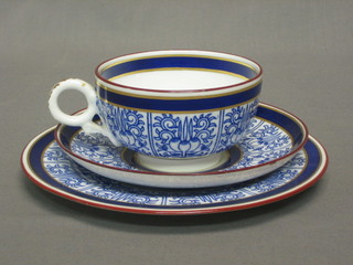 A Victorian Royal Worcester tea plate with blue and gilt banding 7" together with a matching cup and saucer, the reverse with blue Royal Worcester mark and 6 dots
