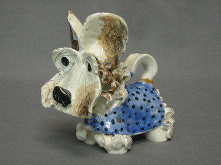 A French Art Pottery figure of a seated dog, the base marked SAS France 4"