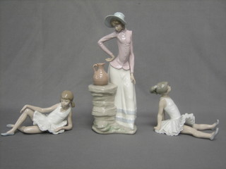 A Lladro figure of a standing lady with viewer 13" and 2 Lladro figures of reclining ballet dancers 8"