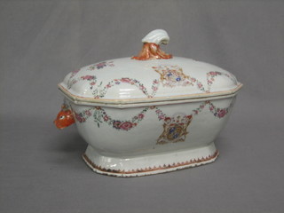 An 18th Century famille rose twin handled armorial soup tureen and cover (heavily f and r) and an armorial porcelain pistol grip knife handle