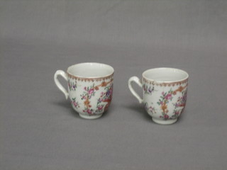 A pair of 18th Century porcelain cups with famille vert decoration