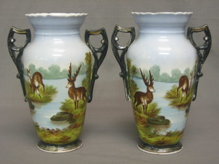 A pair of 19th Century Continental porcelain twin handled vases decorated deer 8 1/2"