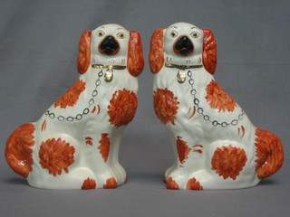 A pair of Staffordshire style figures of seated Spaniels 10"