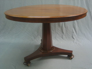 A Victorian  circular mahogany snap top breakfast table, raised on a chamfered column with triform base 40"