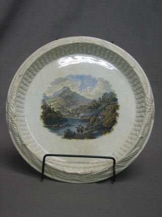 A circular 19th Century Prattware bread dish decorated a Country Scene 12"