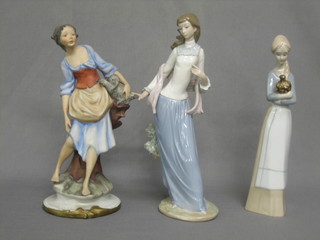 A Nao figure of a standing lady 12", a pottery figure and a biscuit porcelain figure